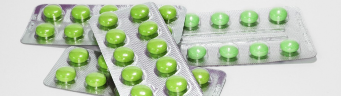 Green pills in packets