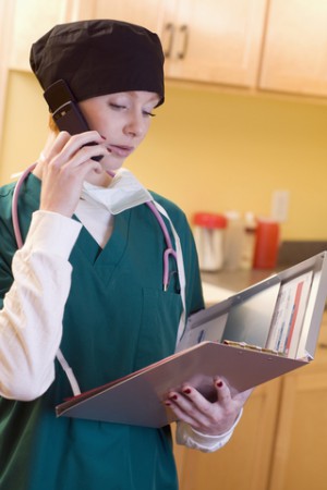 Doctor on phone looking at file